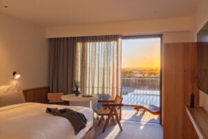 Sunset streaming in through a guest room window