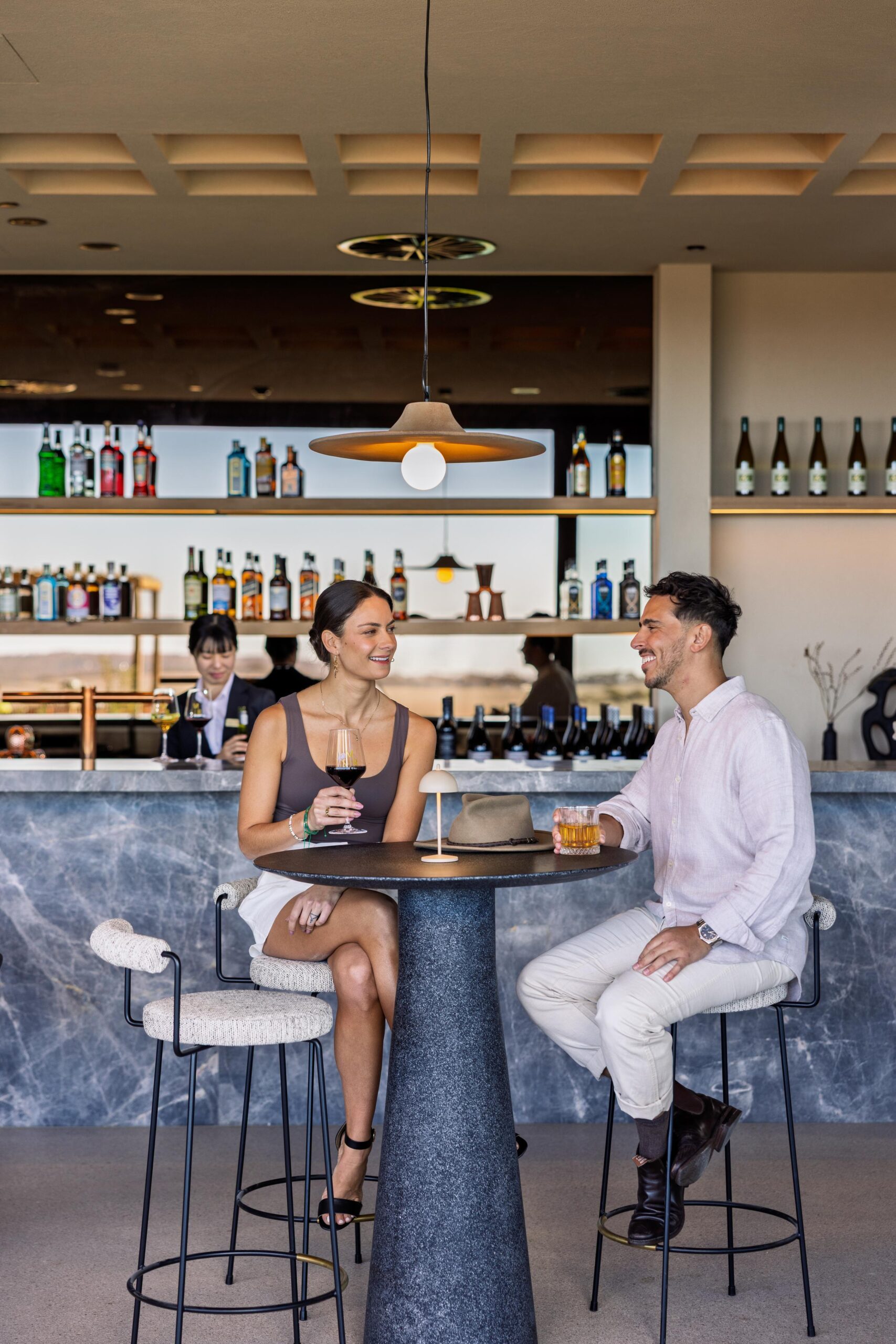 Couple dining on a high table