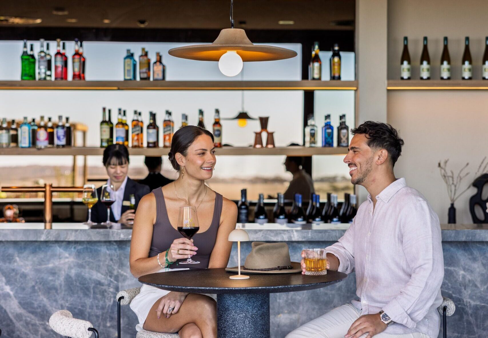 Couple dining on a high table