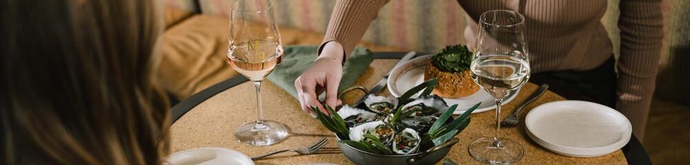 Dining at a table, sharing food