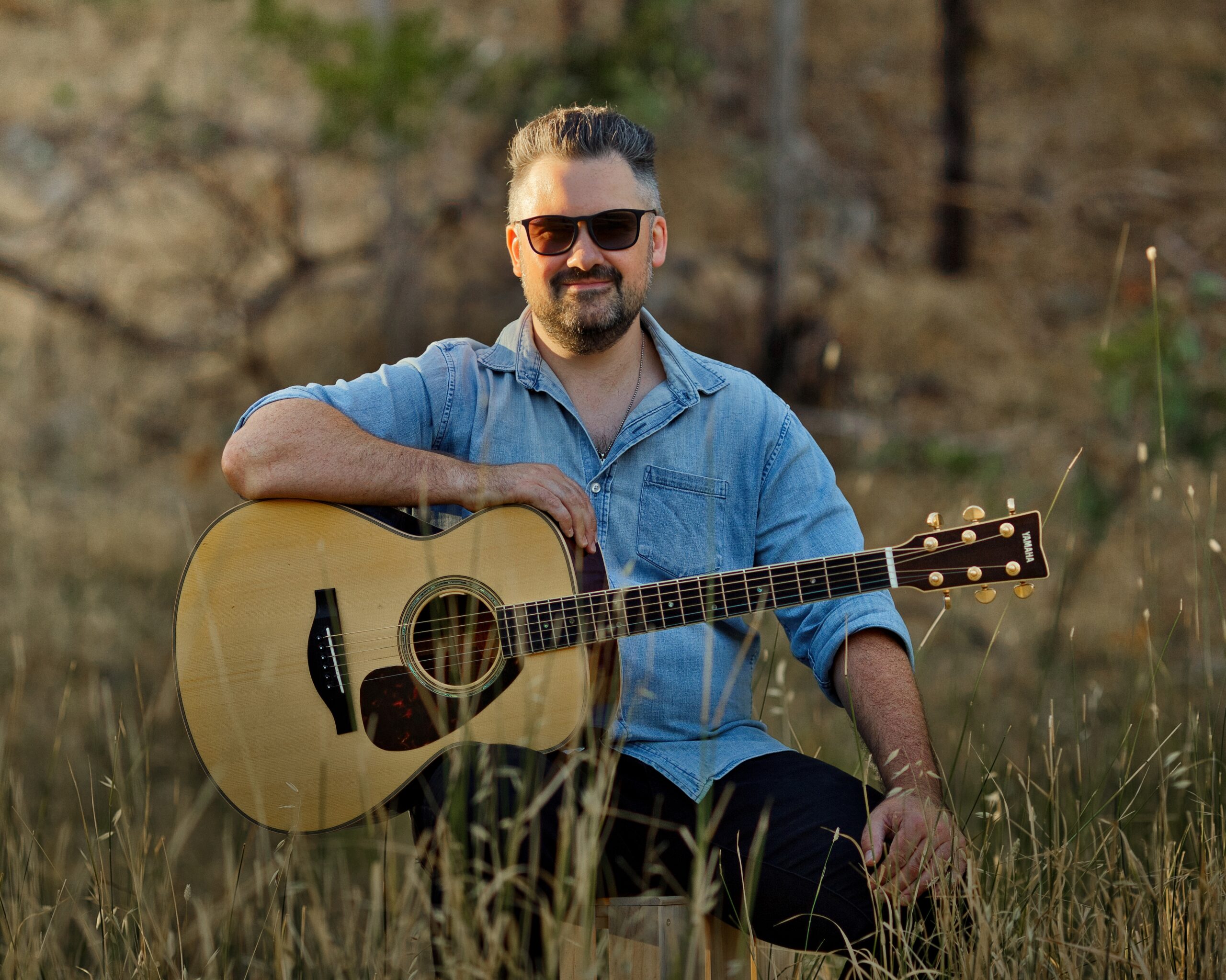 Singer with acoustic guitar